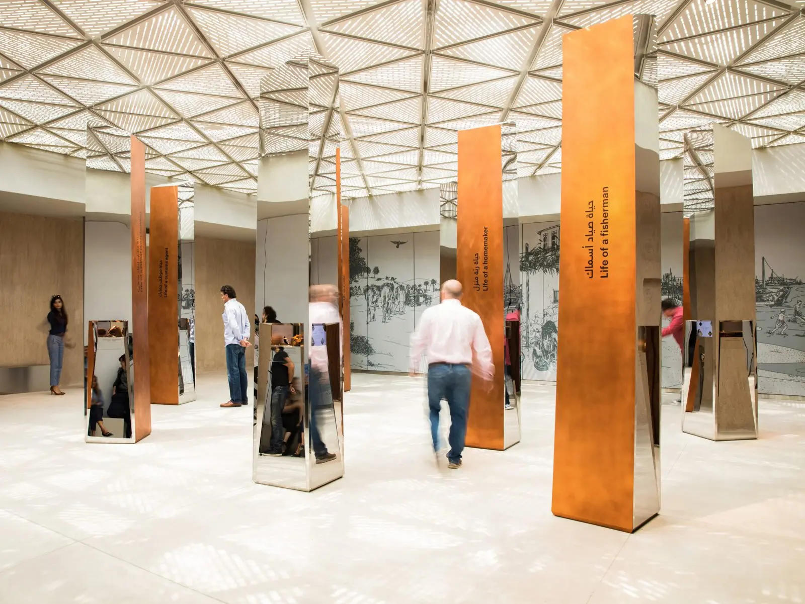 Visitors exploring a gallery inside Al Shindagha Museum