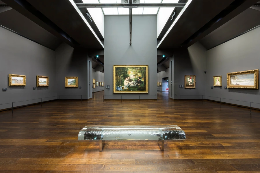 The Musée d’Orsay galleries beneath the former station roof.