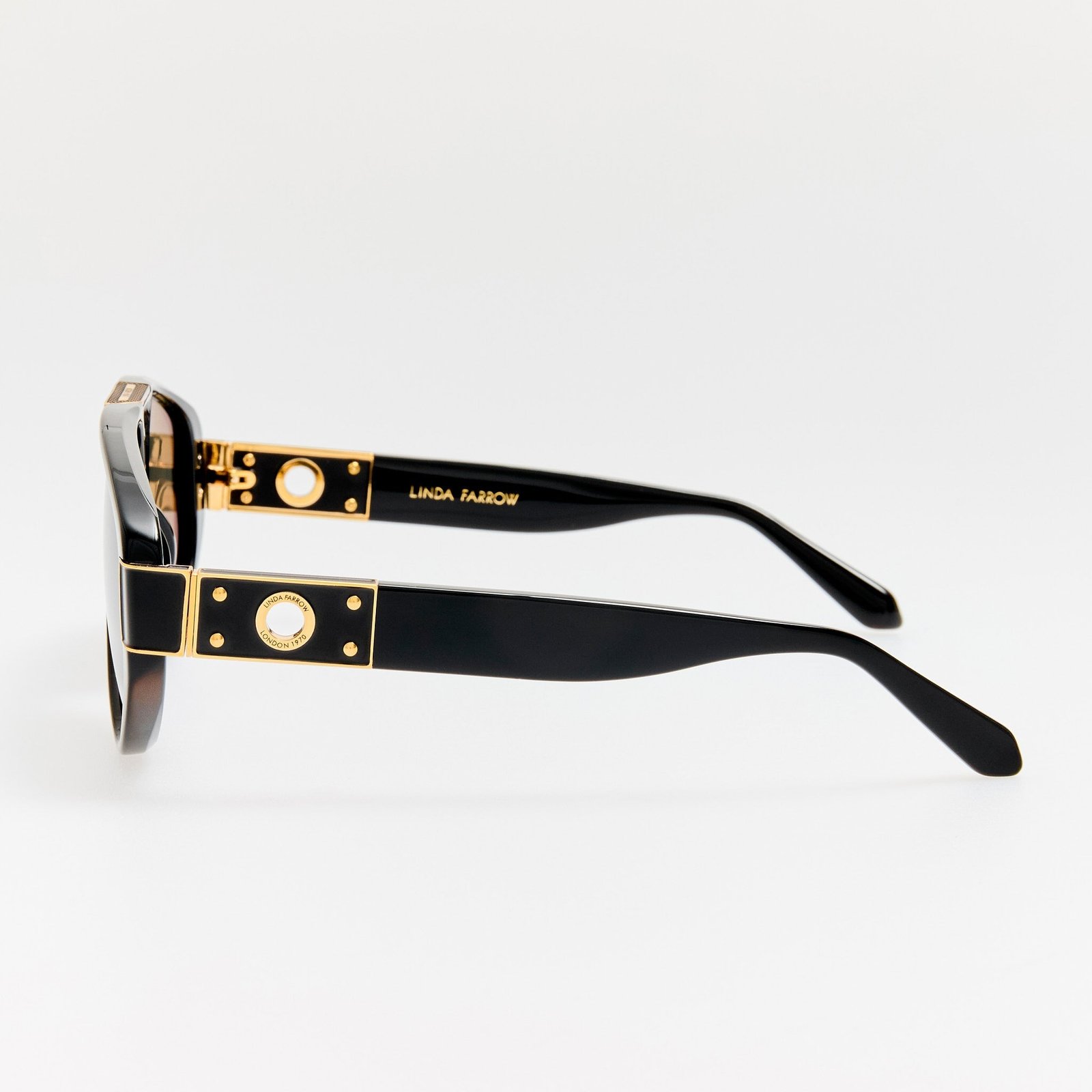 Side view of Linda Farrow Rowan sunglasses with decorative titanium eyelets.