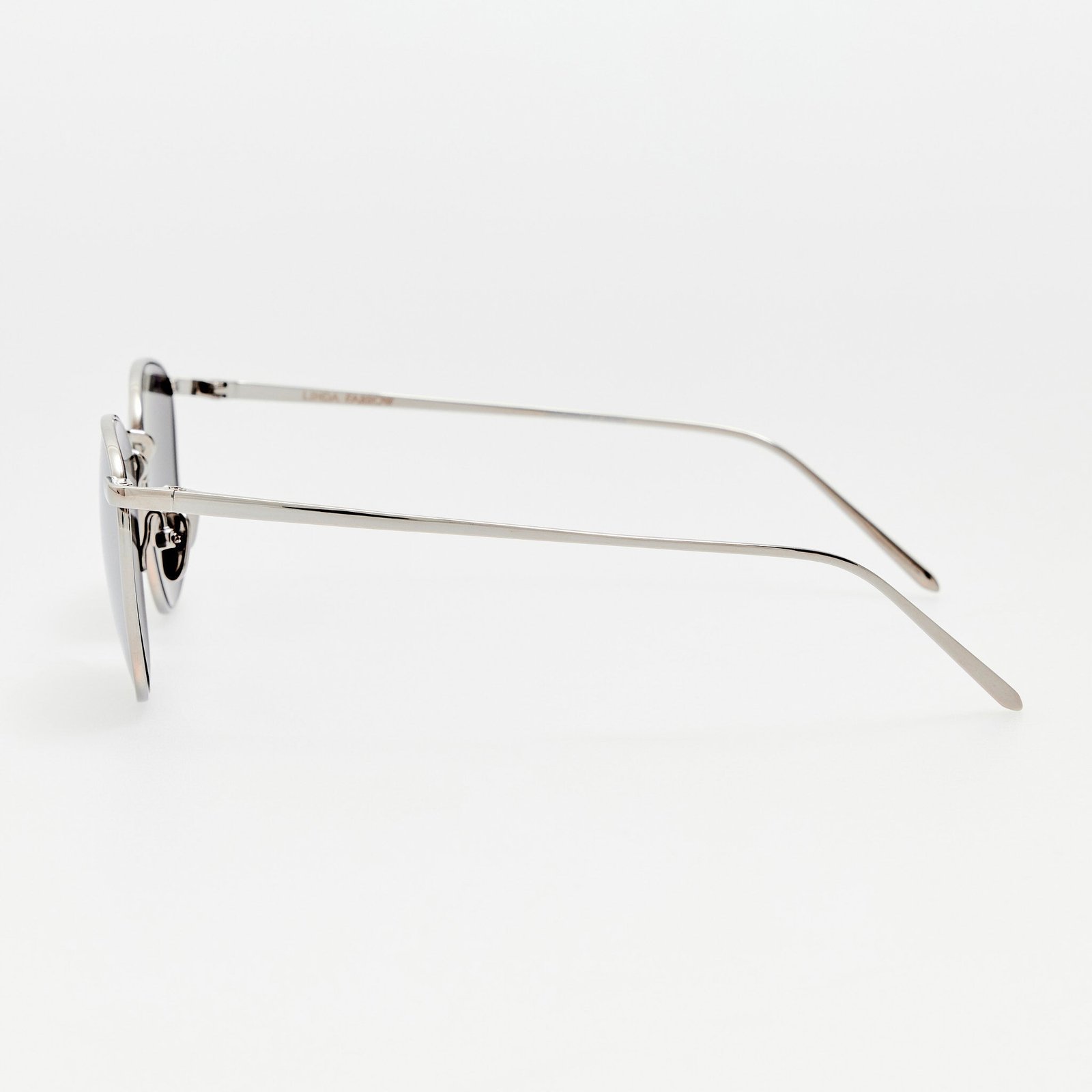 Side view of Linda Farrow Simon sunglasses showing fine metal temples and reflective lenses.