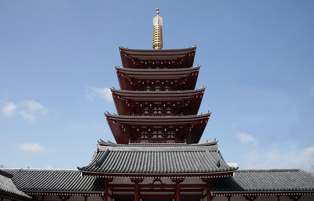 Senso-ji’s five-storey pagoda rising above a tiled roof.